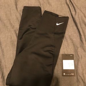 NWT. High wasted, calf length leggings.